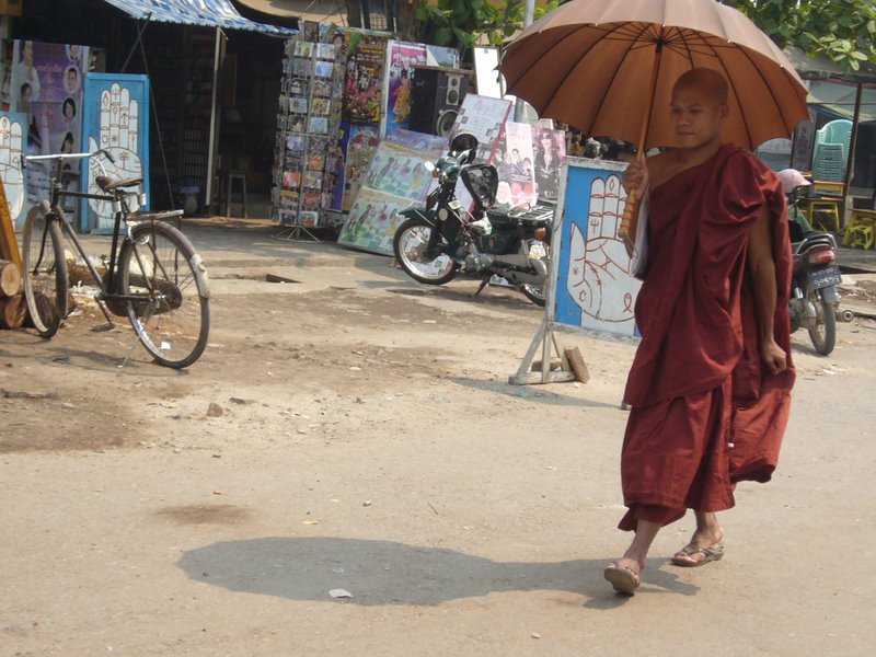 Monk under brolly shade